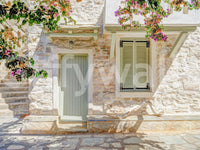 Mediterranean Doorway Charm Wall Mural with stone facade, pale door, and blooms, GD8891
