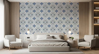 Mediterranean Indigo Fleur Tile Wallpaper behind a low bed in a calm bedroom
