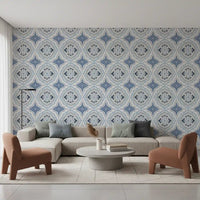Soft living room with Mediterranean Indigo Fleur Tile Wallpaper and tan chairs