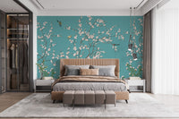 Wall mural of blossoms with teal tones
