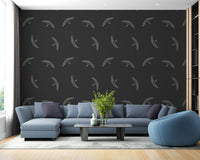 Swallows soaring against black wallpaper design