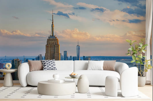 Bright living room styled with Metropolis Sunset Hues Wall Mural behind curved seating