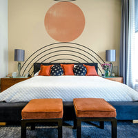 Soft symmetry gives this bedroom a calm look through the Mid-Century wall mural