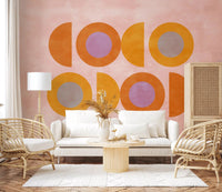 Hallway sunset shapes wall mural showing orange forms on pink base