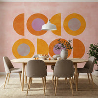 Abstract wall mural with orange, yellow, pink, and lavender forms