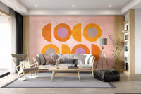 Sunset shapes mural with yellow rings and soft purple center details