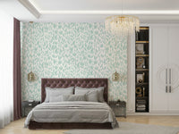 An angled shot of a wall with green wallpaper

