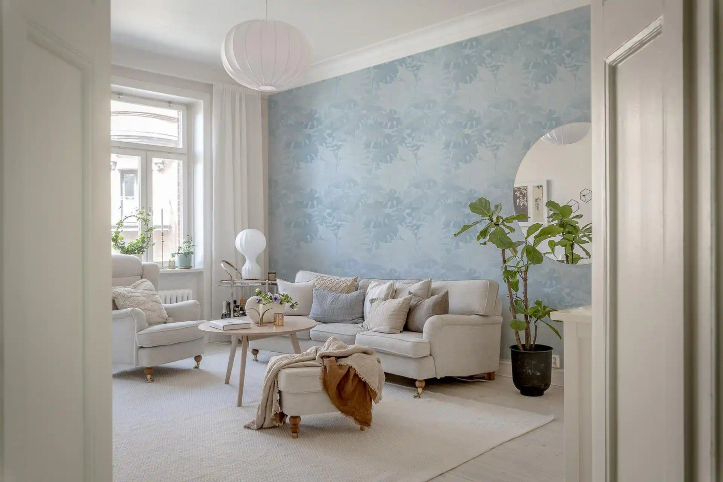 Airy lounge featuring Misty Blue Leaf Layers Monstera Wallpaper, GD8943