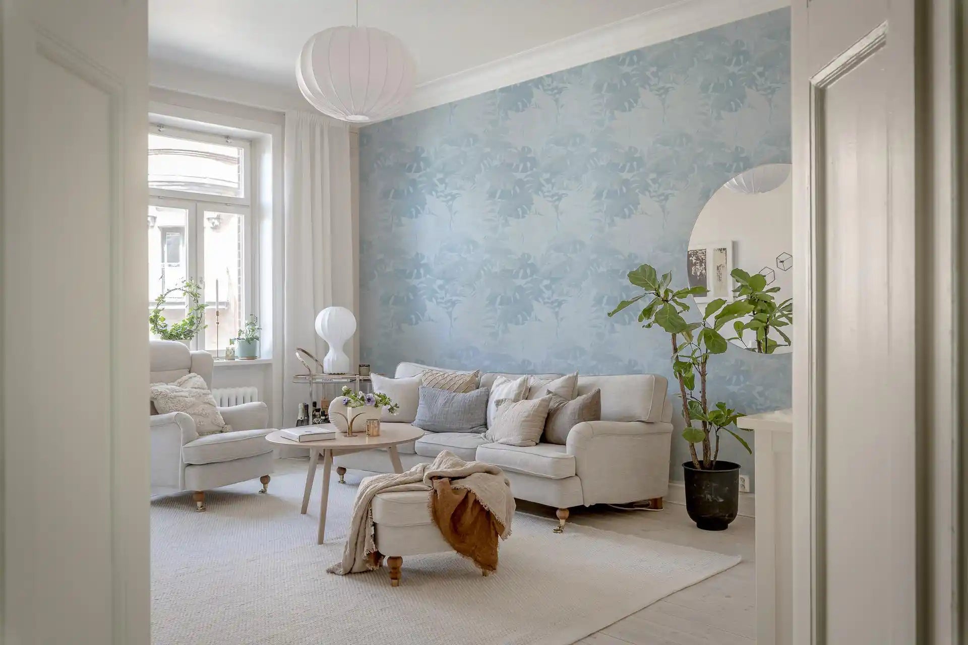Airy lounge featuring Misty Blue Leaf Layers Monstera Wallpaper, GD8943
