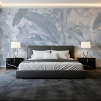 Bedroom wall featuring Misty Blue Tropical Palm mural in faded blue foliage