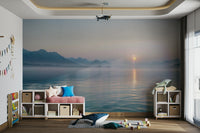 The colors are muted and soft, with shades of gray and orange.

