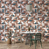 The mural is installed in a calm living room behind a simple, light-colored sofa.

