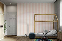 Light striped wallpaper with soft pink and beige hues.

