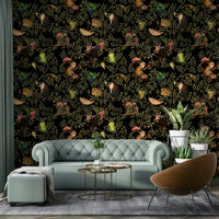 Jungle-themed wallpaper with monkeys swinging from vines.

