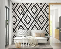 Mosaic-style wall art in shades of gray and white


