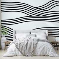Entryway wall with black and white wave design

