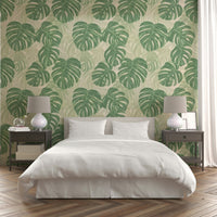 Large Monstera leaves wallpaper for tropical flair.

