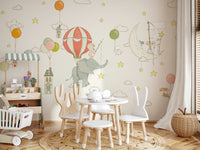 A beautiful whimsical hot air balloon wallpaper mural flying at night under a moonlit sky.