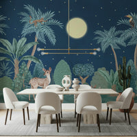 Botanical Moonlit Jungle wallpaper behind a contemporary velvet sofa.