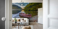 A peaceful wall mural of a small boat on a lake.

