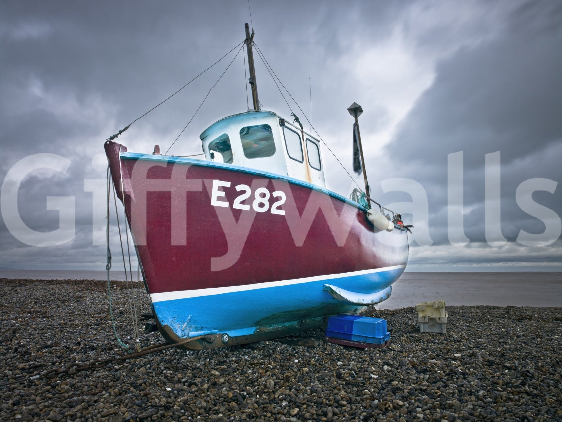 Moored in Serenity Wall Mural showing a red fishing boat beneath layered gray skies, GD8632