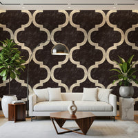 Black and brown ogee pattern wallpaper mural for a bedroom feature wall.