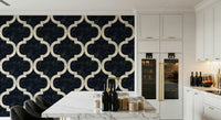 Close-up of Moroccan ogee wallpaper in ink black with crisp, symmetrical curves.
