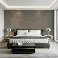 Close-up view of the natural mottled rock effect wallpaper.