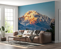 Mountain Dawn Wall Mural showcasing snow and rocky terrain wallpaper.