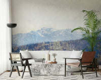 A graceful subtle mountain wall mural in cool, natural tones.