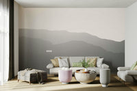 A minimalist home office with the scenic mountain wallpaper.