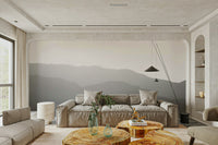 A close-up of the layered, misty mountains at dusk.