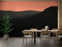 A minimalist home office with the scenic mountain wallpaper.