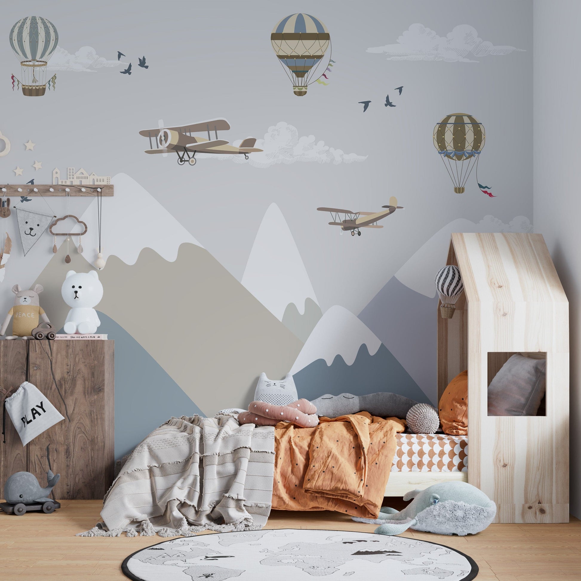 Airplanes flying over mountains wallpaper for kids room
