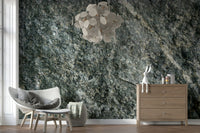 Natural stone finish wallpaper mural behind a sofa.