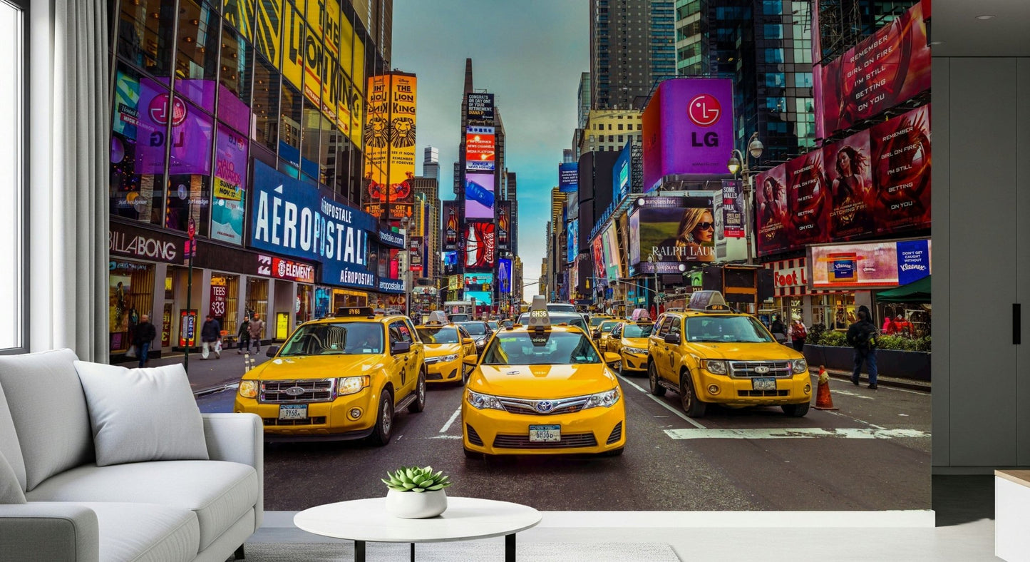 Iconic yellow cabs on a bustling city street wall mural with tall buildings.