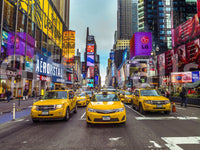 Vibrant city lights wallpaper showing a busy intersection and tall skyscrapers.