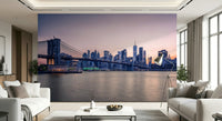This wide living area, NYC Bridge at Dusk Wall Mural creates a polished skyline feature