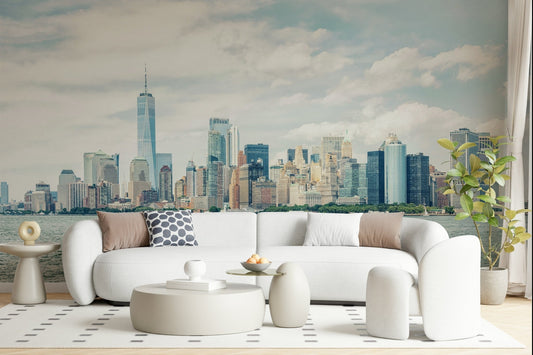 This modern living room feels lighter with NYC Skyline View Wall Mural and calm water views