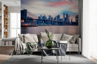 NYC Twilight Dreams wall mural with glowing skyline in a modern living room.
