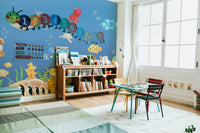 The background shows gentle ocean currents and soft light filtering from above.
