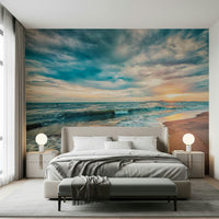 Nursery wall finished with Ocean Hues Wall Mural and a calm coastal sunset scene