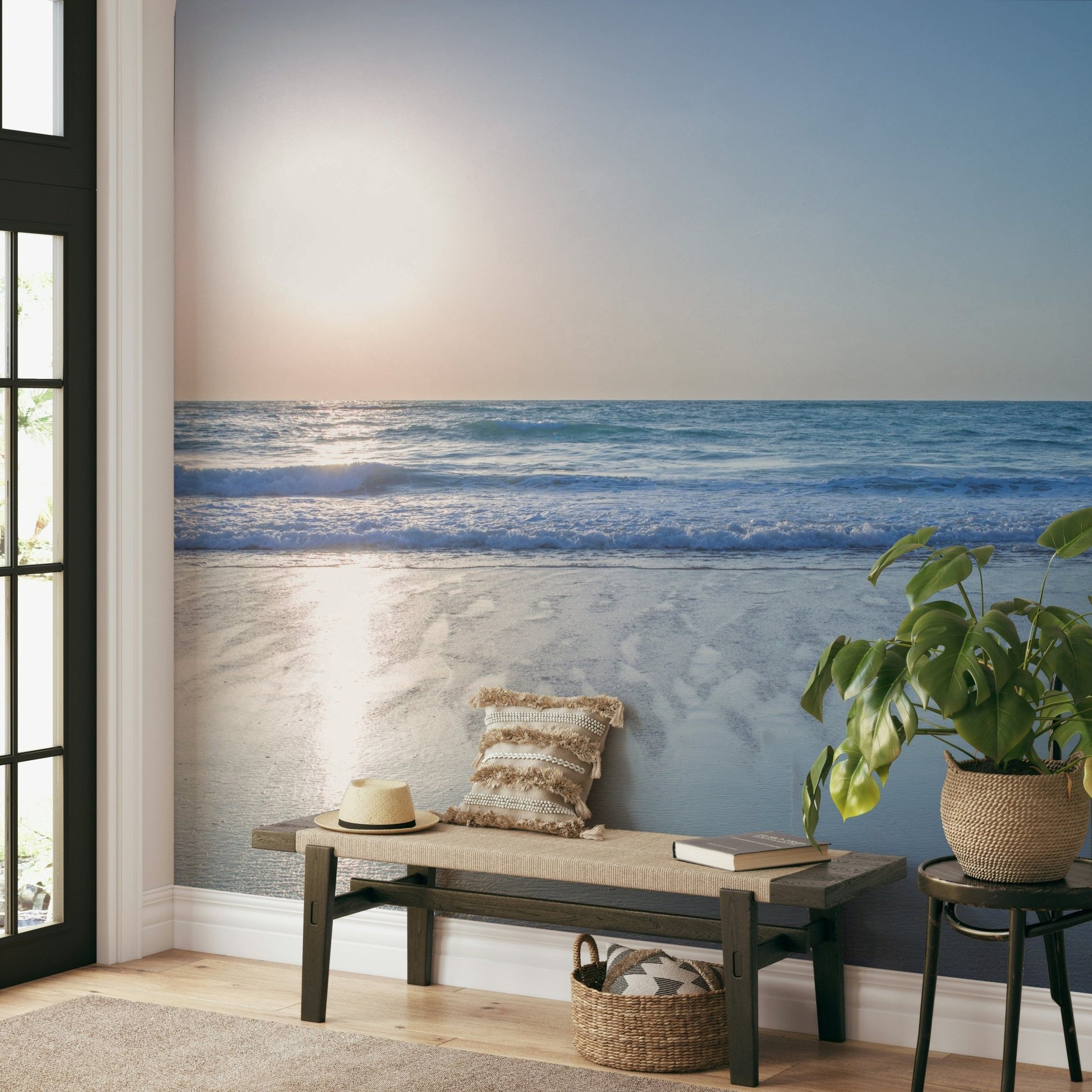 The water is calm, with small, soft waves rolling onto the shore.

