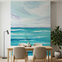 Above dining room seating, Ocean's Embrace wall mural keeps the mood open and easy