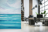 Ocean's Embrace wall mural suits a home office with its calm horizon and fluid blues