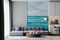 The Living room feels lighter with Ocean's Embrace seascape wall mural in aqua hues
