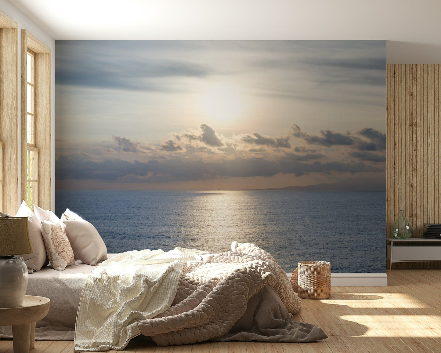 Minimalist seascape wallpaper with golden glares and deep blue water.