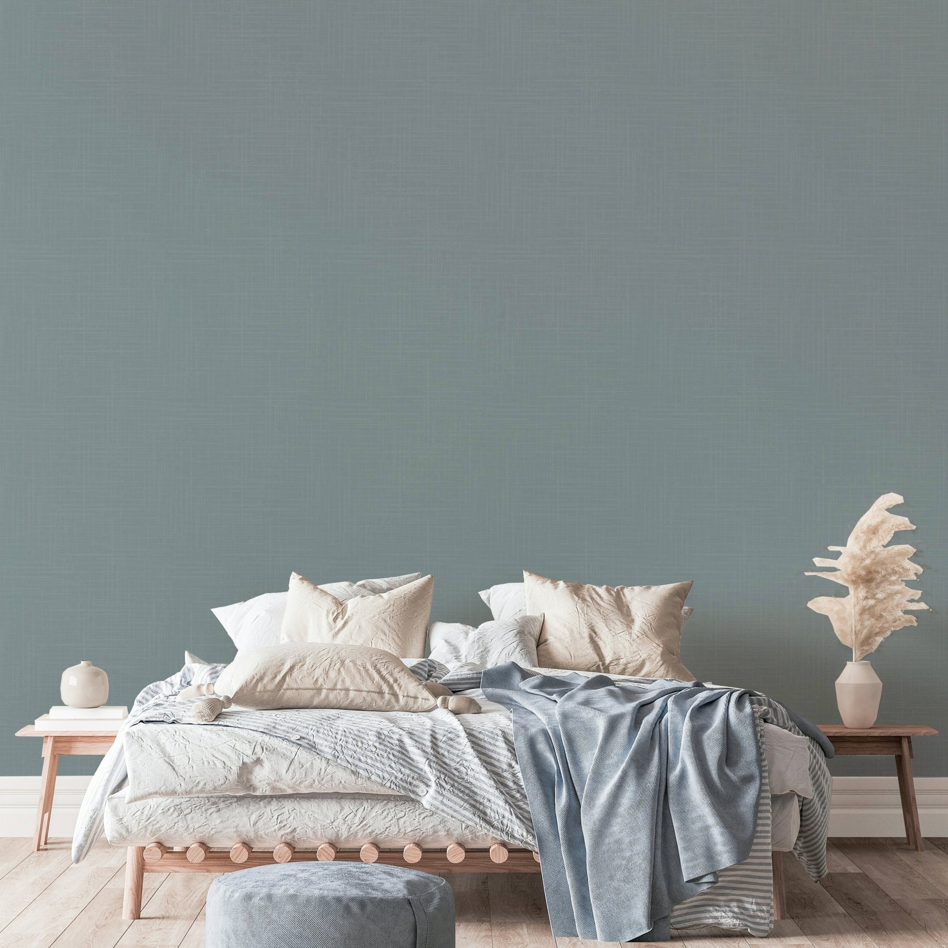 The image shows a full wall with a soft, worn texture.

