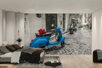 A wall mural of a vintage blue scooter.

