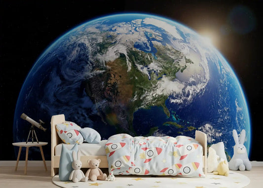 A kids bedroom opens up into space with the Orbital Dawn wall mural on the back 